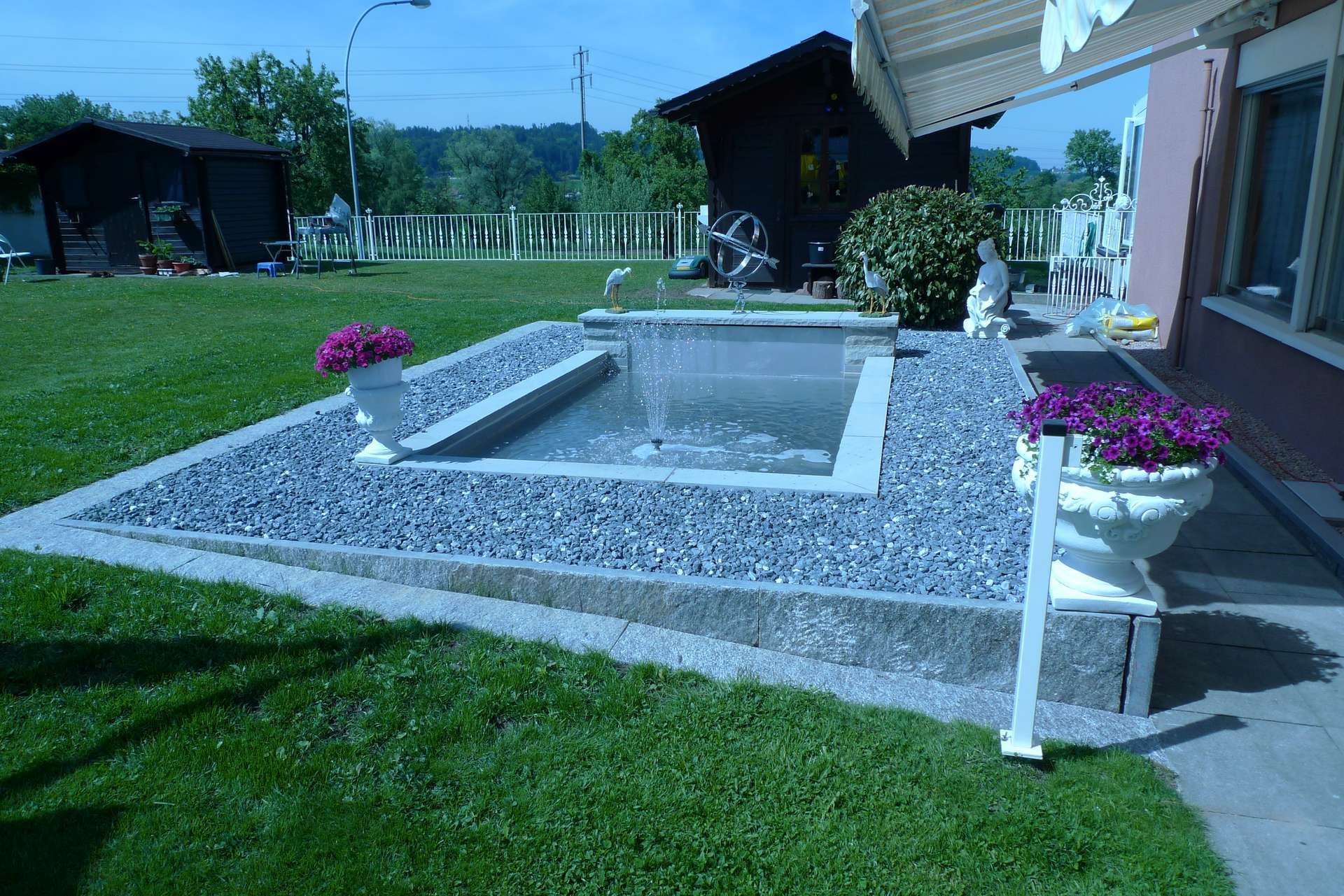 Laederach Gartenbau - Gartenbrunnen - Gartenteich - Gartenbau