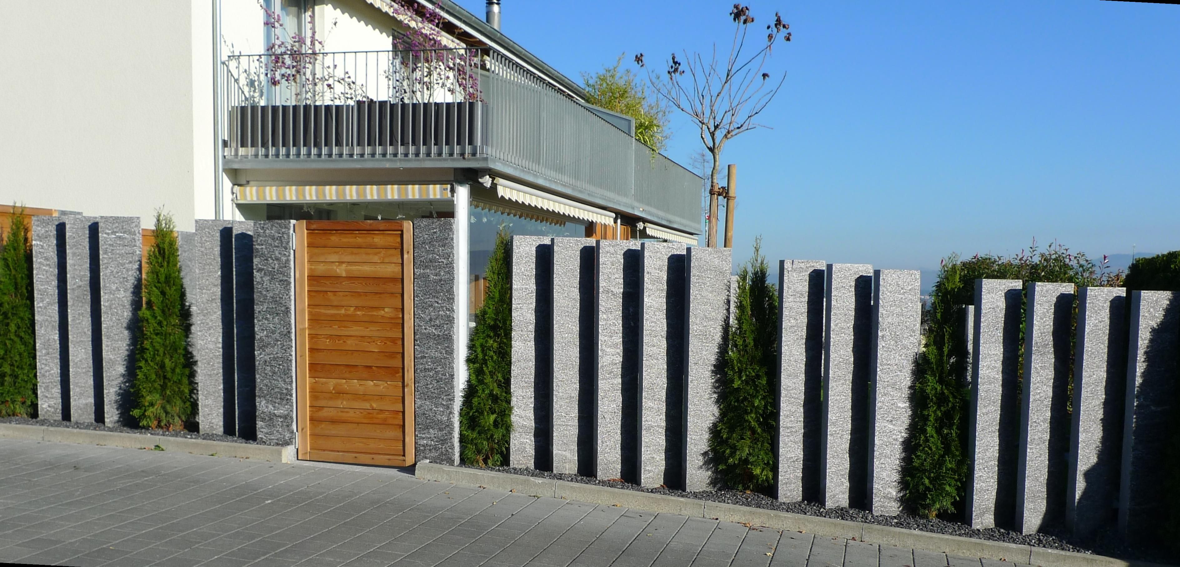 Laederach Gartenbau - Sichtschutzwand mit Natursteinpalisaden - Gartenbau